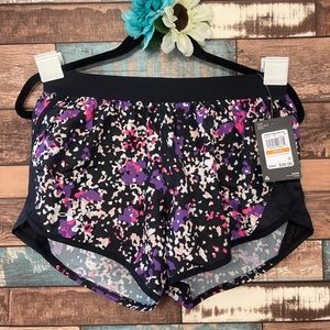 Under Armour Women's Fly-By 2.0 shorts. Black/purple/pink. Size small. NWT.